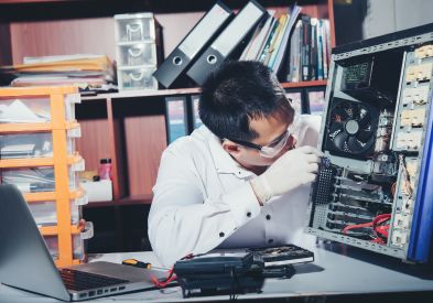Technician repairing desktop computer in Al Barsha Dubai
